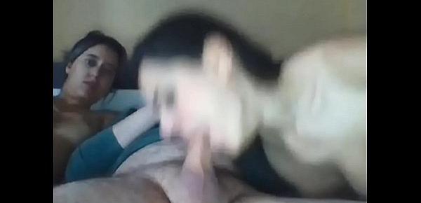  two girls in a threesome sucking and fucking a big cock